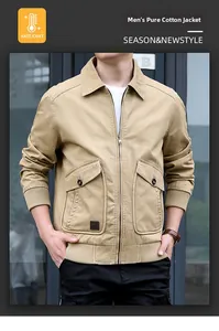 Detail of khaki cotton bomber jacket featuring utility flap pockets and ribbed cuffs
