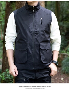 Close-up of black tactical vest featuring utility pockets and stand-up collar design