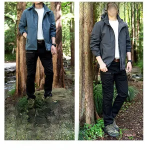 Detail of waterproof men's outdoor jackets in mist blue and dark grey with hood