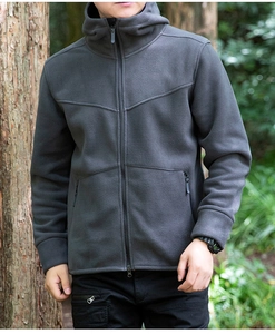 Detail of dark grey fleece hoodie with V-shaped stitching and zip pockets