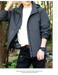 Close-up of men's dark grey hooded windbreaker with breathable black mesh lining detail