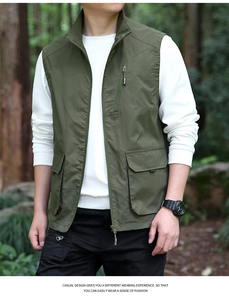 Detail view of military green utility vest with multi-pocket design and stand collar