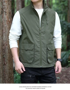 Detailed view of army green outdoor utility vest featuring multi-pocket cargo design