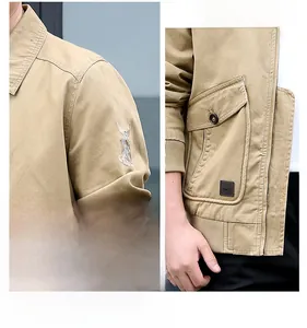 Detail of khaki men's cotton flight jacket featuring tactical pockets and embroidered badges