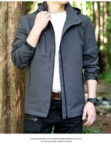 Detail of grey outdoor jacket featuring waterproof zippers and adjustable cuffs for men