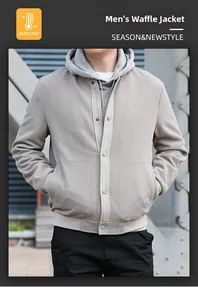 Detailed view of grey waffle knit jacket texture with button closure and ribbed cuffs
