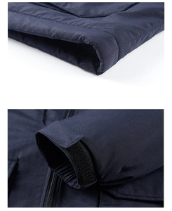 Detail of navy blue windbreaker featuring adjustable velcro cuffs and high-quality stitching