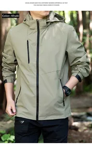 Detail of khaki outdoor hooded jacket featuring zipper pocket and adjustable elastic cuffs
