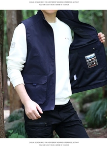 Detail view of deep blue outdoor utility vest featuring breathable mesh lining and inner pocket