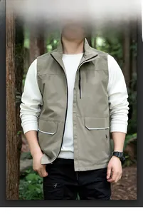 Detail of light khaki outdoor vest with stand collar and reflective pocket flaps
