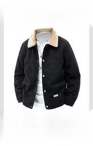 Detail of black corduroy jacket with beige shearling collar and white metal snap buttons
