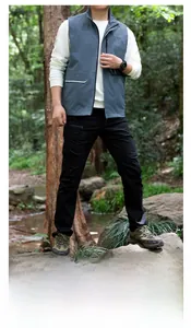 Detailed view of the men's outdoor vest featuring a stand collar and multiple large pockets