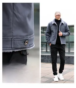 Detail of dark grey winter jacket with thick faux fur collar and warm fleece lining