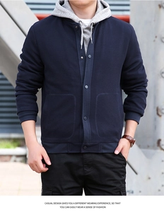 Close-up of men's dark blue waffle texture jacket with classic stand collar and buttons