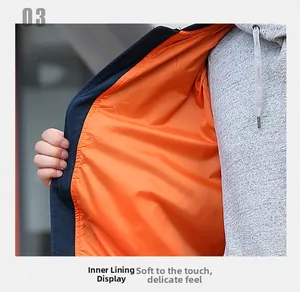 Détail de la doublure orange en polyester lisse de la veste cargo techwear