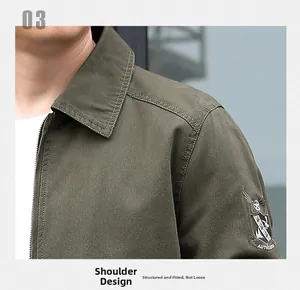 Detail of military green cotton jacket showing reinforced shoulder seams and sleeve patch