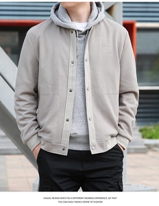 Close-up of waffle textured men's casual jacket featuring snap buttons and ribbed cuffs