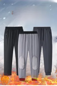 Detail view of thickened fleece lining and knee thermal patches in winter joggers