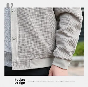Detailed close-up of men's waffle textured jacket with snap buttons and side pockets