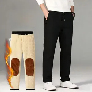 Close-up of winter fleece trousers featuring soft yellow lining and brown knee heating pads