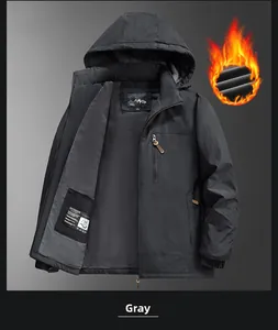 Detail view of windproof jacket with thick gray fleece lining and orange warmth effect