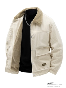 Detail of beige corduroy jacket showing soft sherpa lining and metal snap buttons
