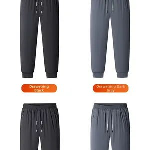 Detail of men's joggers with elastic drawstring waist and secure side zipper pockets