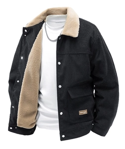 Detail of black corduroy jacket showing beige sherpa collar and warm inner fleece lining