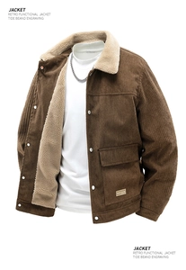 Detail of vintage brown corduroy jacket with thick stripes and warm sherpa fleece lining