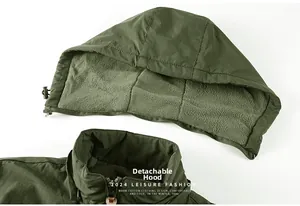 Detail view of military green waterproof jacket featuring a detachable fleece-lined hood