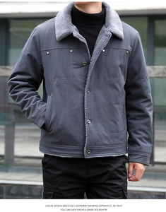 Detail of grey lamb wool collar and structured stitching on a winter jacket for men