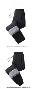 Detail of men's fleece-lined thermal pants showing elastic waist and soft fleece interior