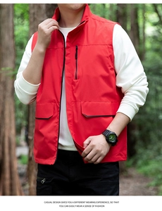 Close-up of red outdoor vest with vertical zipper chest pocket and stand collar