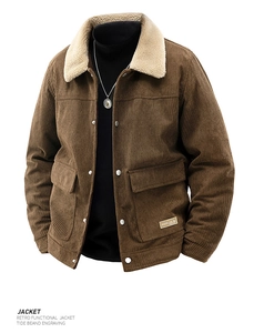 Detailed close-up of dark brown corduroy jacket featuring a beige faux shearling collar