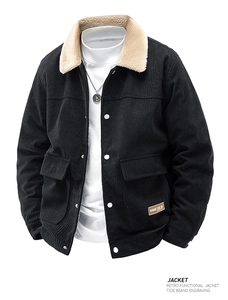 Detail of black corduroy jacket with sherpa collar and buttoned utility pockets