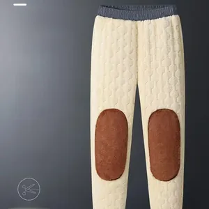 Detail of warm thermal pants with honeycomb texture and reinforced brown knee patches