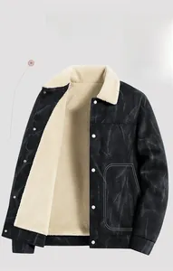 Close-up of black suede jacket with thick white shearling lining and silver metal buttons