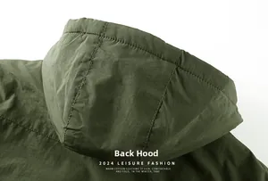 Detailed back view of the dark green windproof hood with reinforced stitching for jackets