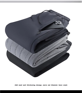 Detail of fleece lining and zip pockets on heavy thermal joggers for men winter