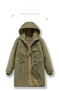 Detailed macro view of military green cotton jacket with thick khaki lamb wool lining