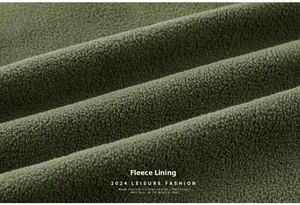 Close-up of thick fleece lining on green outdoor jacket for maximum thermal warmth