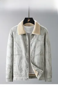 Detail of gray faux suede jacket featuring a beige faux fur collar and metal snap buttons