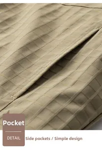 Macro shot of khaki checkered fabric showcasing side pocket stitching and premium texture