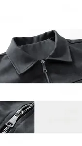 Detail view of the retro PU leather jacket collar and metallic zipper hardware texture