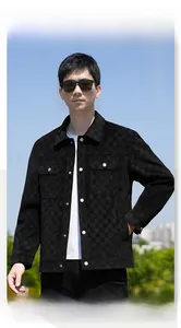 Detail of black checkered knit fabric on men's casual jacket with metal snap buttons