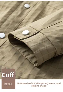 Detail view of khaki checkered jacket cuff with high-quality metal snap button