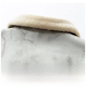 Detail of grey faux suede jacket featuring a soft white faux shearling collar texture