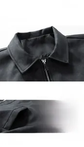 Detail of vintage gray biker jacket showing zip closure and suede texture stitching