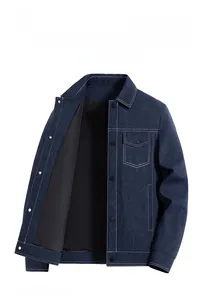 Detailed close-up of dark blue jacket with contrast white stitching and letter texture
