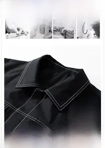 Detailed view of black jacket collar with white contrast stitching and snap button